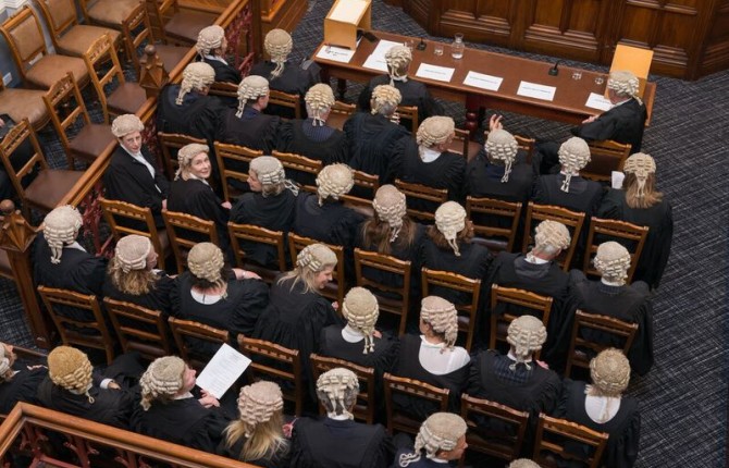 lawyers seated with wigs